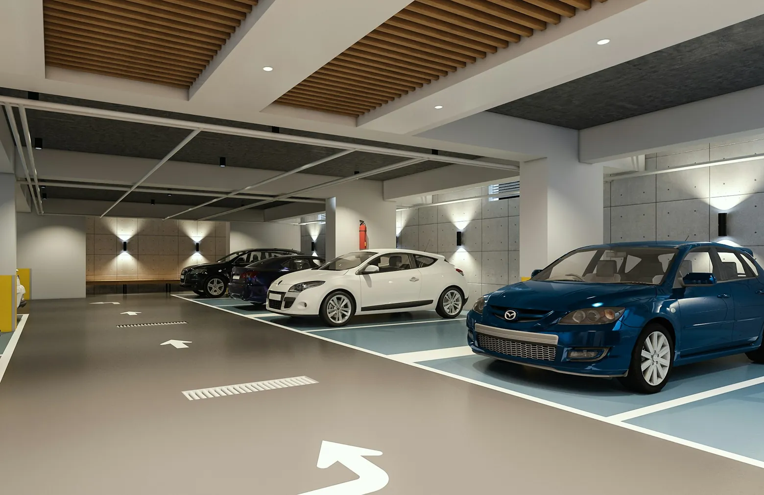 Cars parked in a bright indoor parking garage
